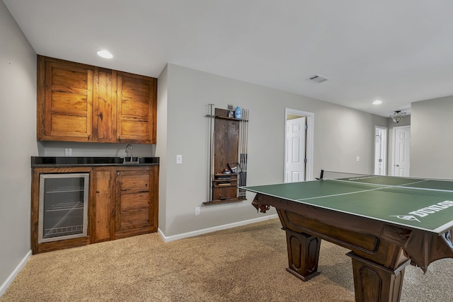 game room with carpet flooring, sink, and wine cooler