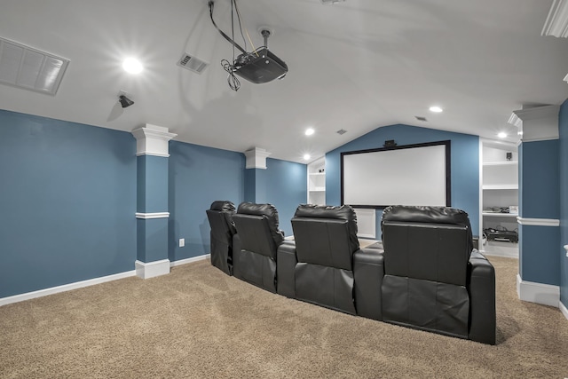 home theater with decorative columns, lofted ceiling, carpet floors, and built in features