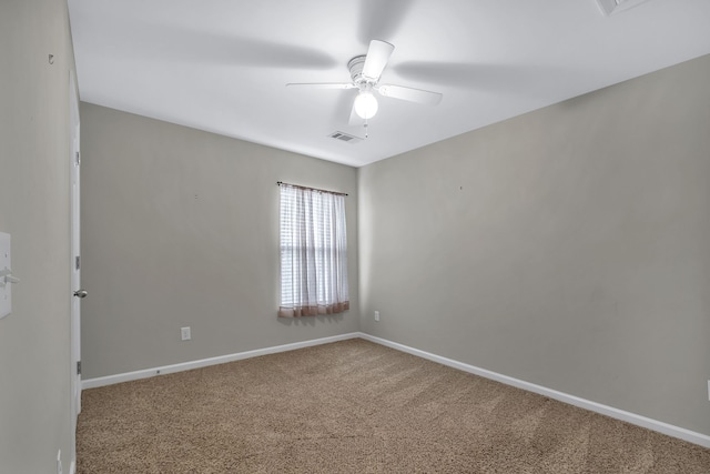 carpeted empty room featuring ceiling fan