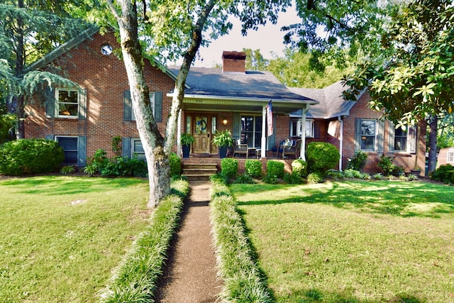 view of front of home with a porch and a front lawn