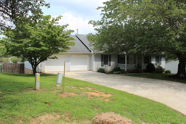 view of front of home with a garage, covered porch, and a front lawn