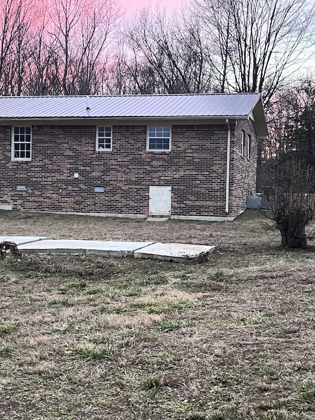 view of property exterior at dusk