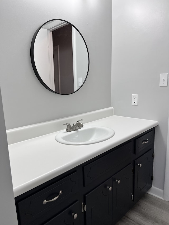 bathroom featuring vanity and wood-type flooring