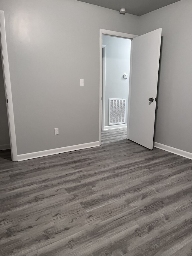 empty room featuring hardwood / wood-style flooring