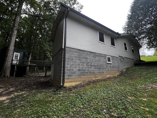 view of property exterior featuring a deck