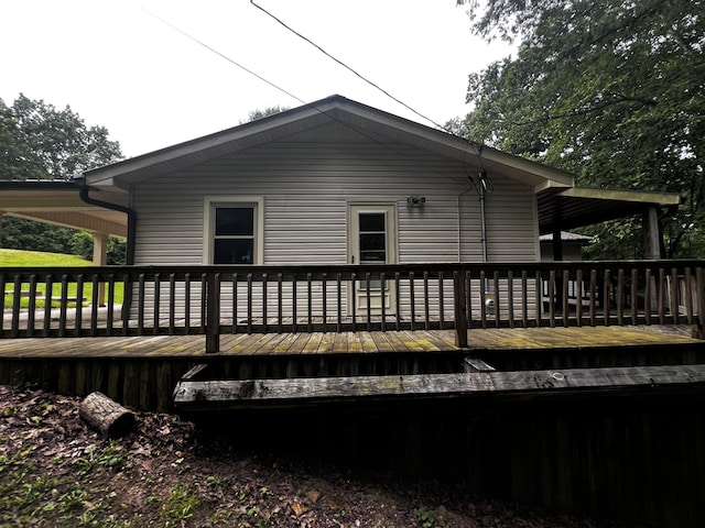 view of side of property with a wooden deck