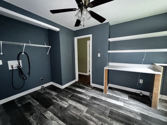 interior space with ceiling fan, dark wood-style flooring, and baseboards