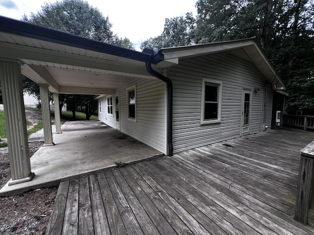 wooden terrace featuring a patio area