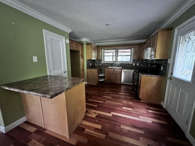 kitchen with a peninsula, ornamental molding, a sink, dishwasher, and backsplash