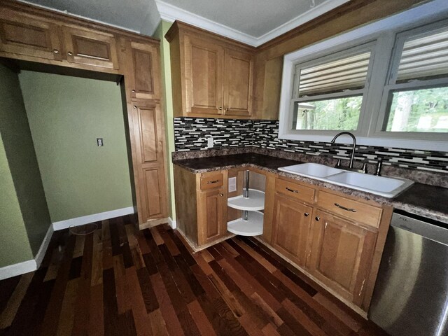 kitchen with a sink, tasteful backsplash, dark wood finished floors, and dishwasher