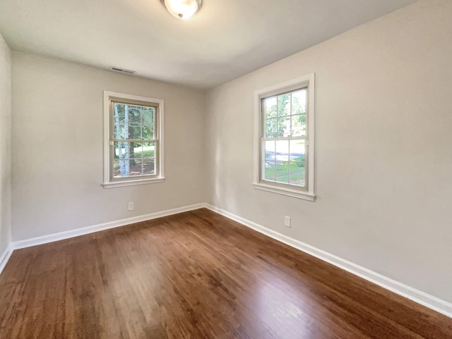 empty room featuring dark hardwood / wood-style floors