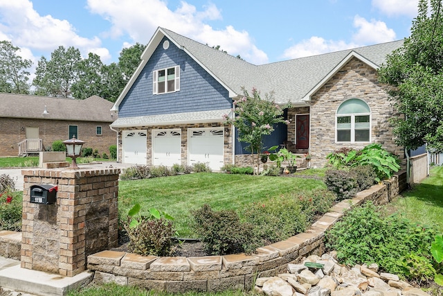 view of front of home with a garage and a front yard