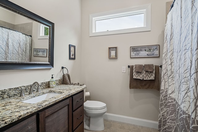 bathroom with tile patterned floors, toilet, and vanity