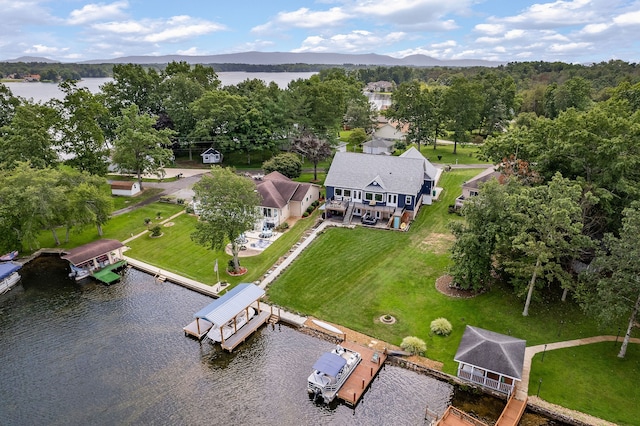 drone / aerial view featuring a water and mountain view