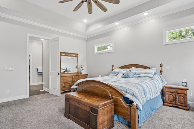 bedroom with crown molding, a raised ceiling, light colored carpet, and ceiling fan