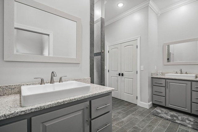 bathroom with ornamental molding, tile patterned floors, and double vanity