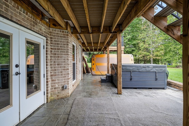 view of patio / terrace with a hot tub