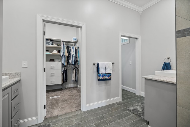 bathroom featuring vanity and ornamental molding