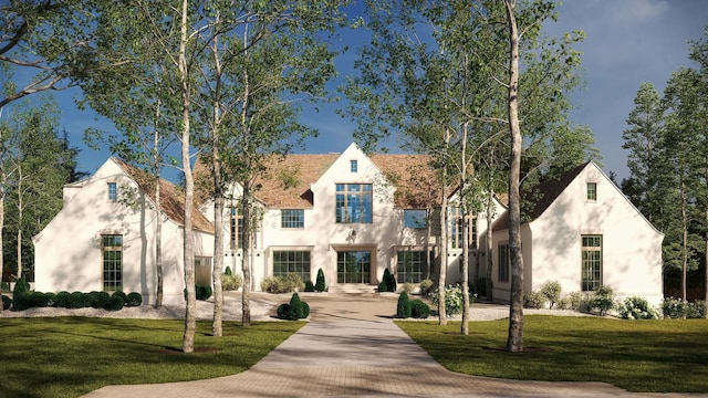 view of front of property with a front lawn and stucco siding