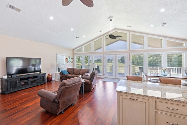 living room featuring dark hardwood / wood-style flooring, french doors, and ceiling fan