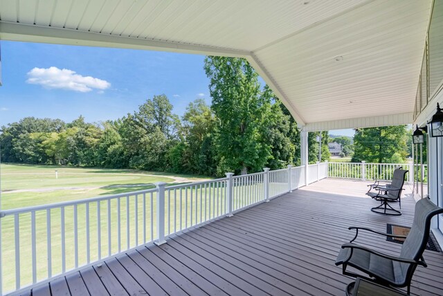 wooden deck with a yard