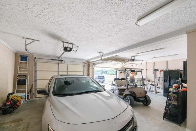 garage featuring a garage door opener and refrigerator with ice dispenser