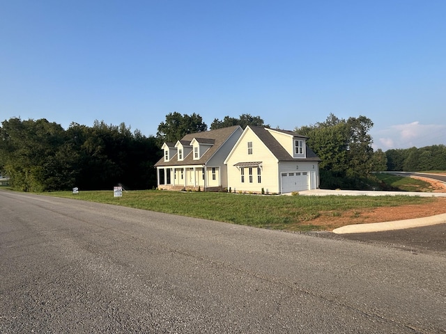 view of front facade with a garage and a front yard