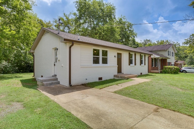 ranch-style home featuring a shingled roof, a front yard, crawl space, and brick siding