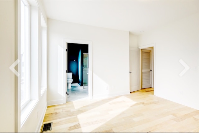 unfurnished room with light hardwood / wood-style flooring