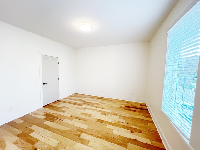 spare room with light hardwood / wood-style floors