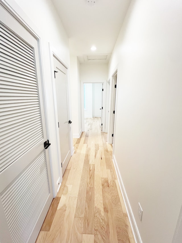 hallway with light wood-type flooring