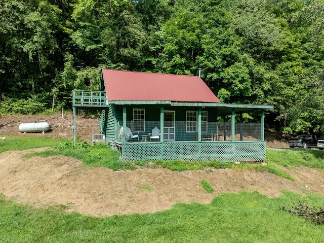 view of front of home with covered porch and metal roof