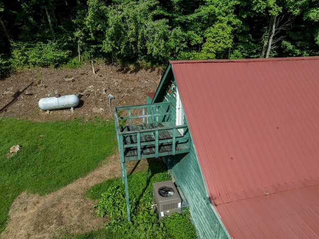 exterior space with ac unit and heating fuel