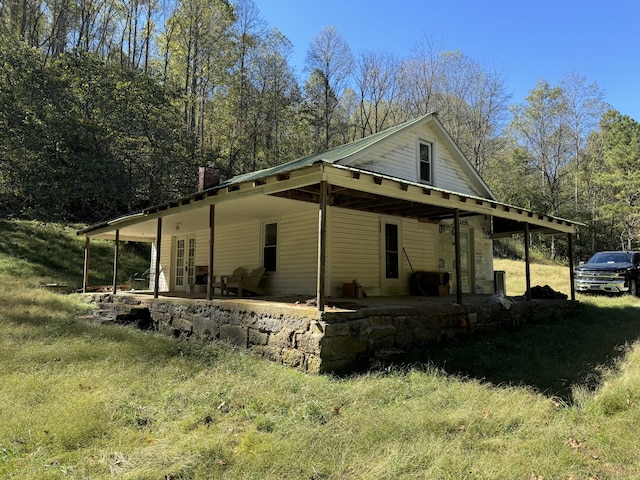 view of side of home with a patio