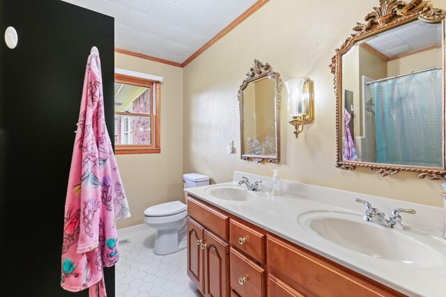 bathroom with ornamental molding, toilet, tile patterned flooring, and dual bowl vanity