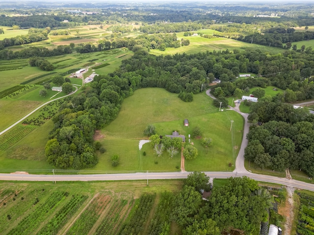 birds eye view of property with a rural view