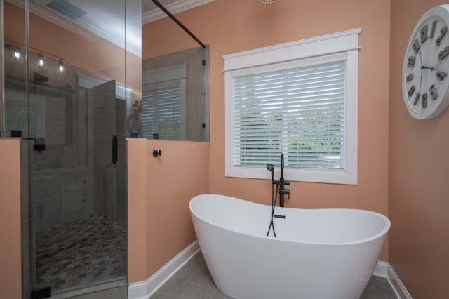 bathroom with tile patterned flooring, crown molding, and shower with separate bathtub