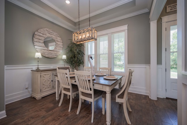 dining room with plenty of natural light, dark hardwood / wood-style floors, and ornamental molding