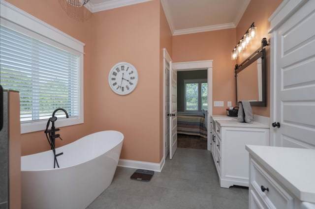 bathroom featuring vanity, crown molding, tile patterned flooring, a tub to relax in, and a chandelier