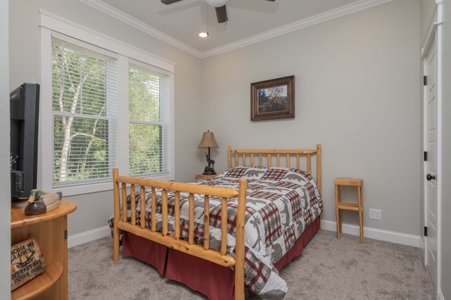 bedroom with multiple windows, ceiling fan, and light colored carpet