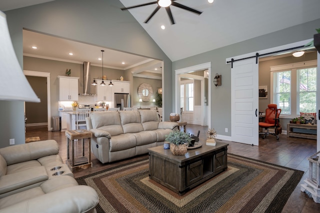 living room featuring ornamental molding, a barn door, high vaulted ceiling, and dark wood-type flooring