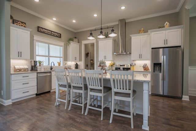 kitchen featuring white cabinets, dark hardwood / wood-style flooring, wall chimney range hood, and stainless steel appliances