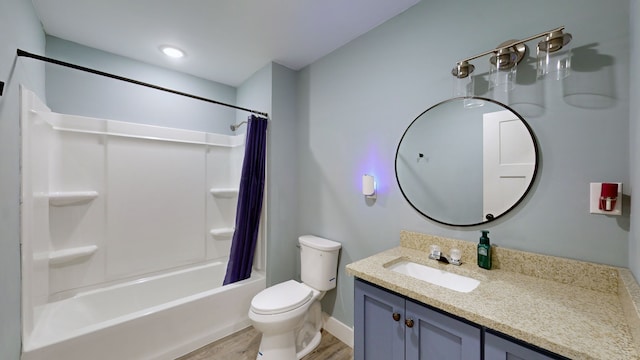 full bathroom featuring vanity, toilet, hardwood / wood-style floors, and shower / bath combination with curtain