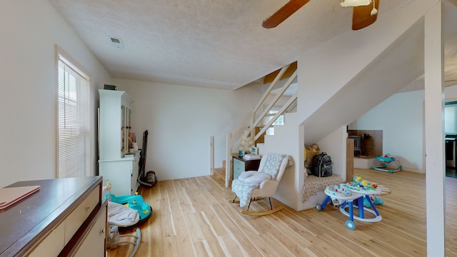 interior space featuring light hardwood / wood-style flooring and ceiling fan