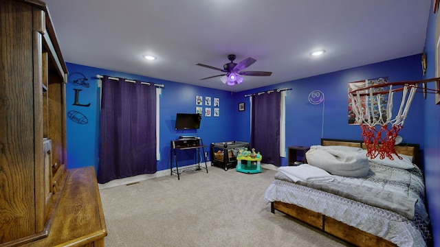 carpeted bedroom featuring ceiling fan