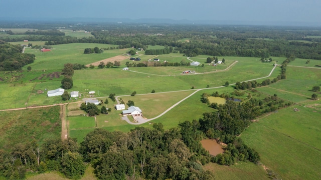 birds eye view of property with a rural view