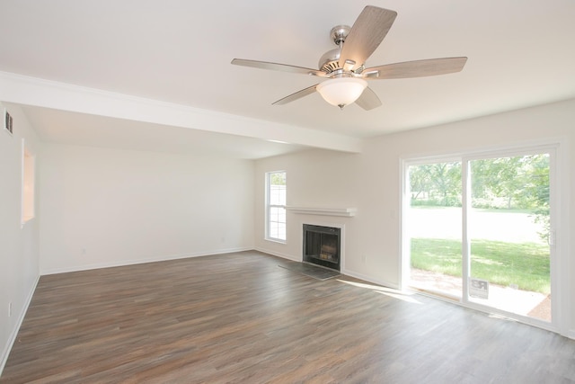 unfurnished living room with ceiling fan and hardwood / wood-style floors