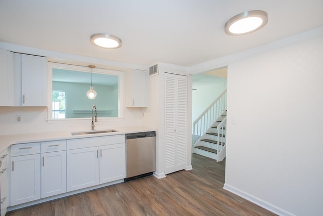 kitchen featuring sink, dishwasher, white cabinets, and dark wood-type flooring