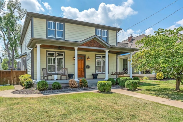 view of front of house featuring a front yard and a porch