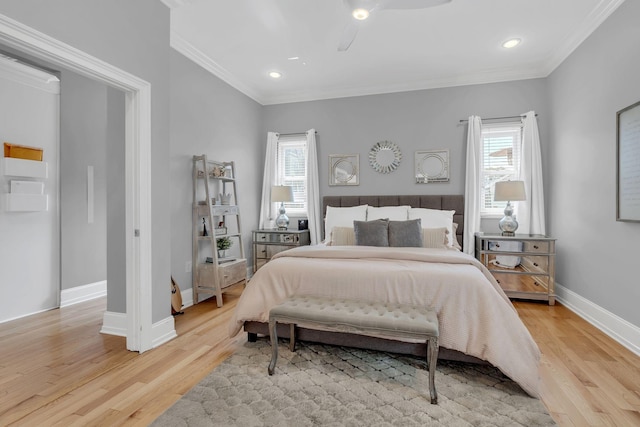 bedroom with crown molding, ceiling fan, and light wood-type flooring